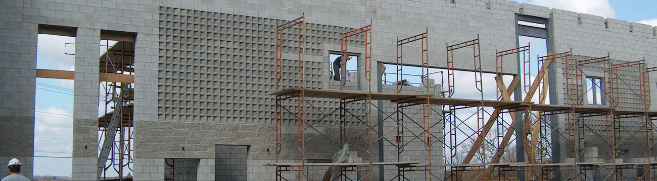 Concrete block wall being constructed