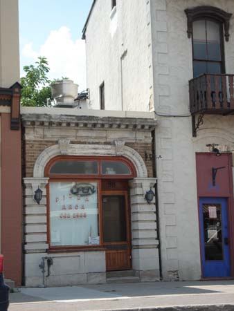 Small building downtown with decorative features
